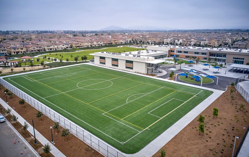 Aerial view of Sonia Sotomayor Elementary School, play areas, and athletic field